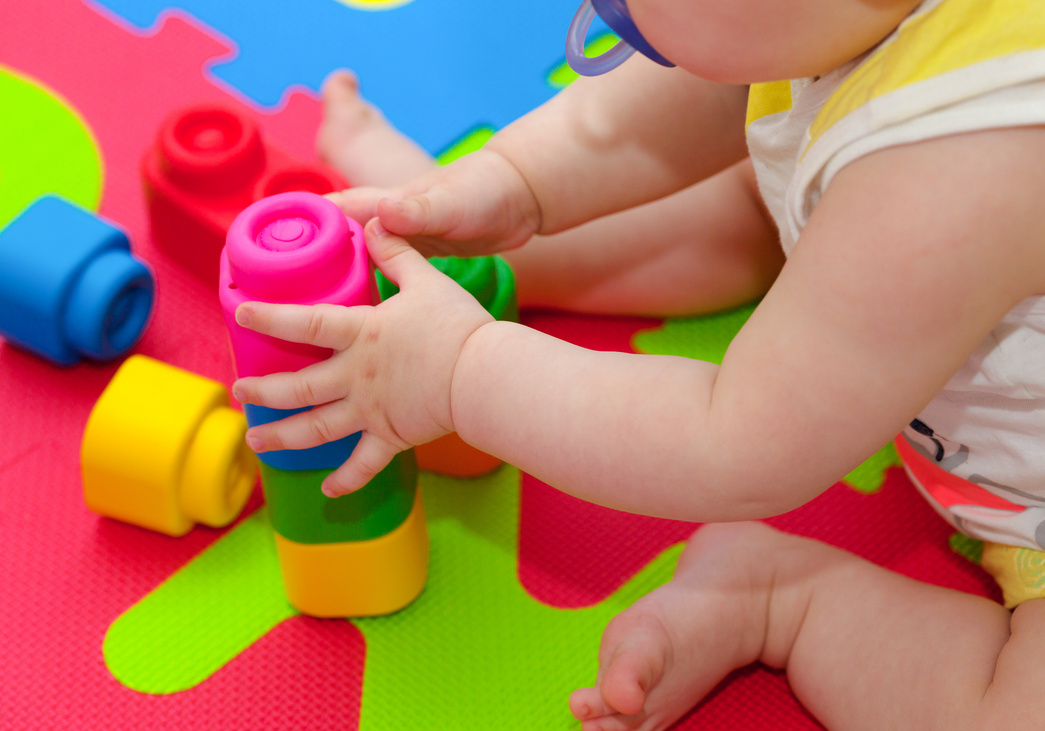 Baby Playing with Building Blocks